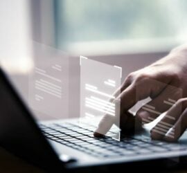 hand-using-laptop-computer-with-virtual-screen-and-document-for-online-approve-paperless-quality-assurance-and-erp-management-concept