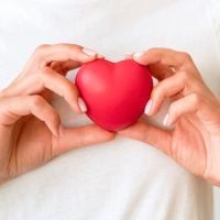 front-view-of-woman-holding-heart-shape