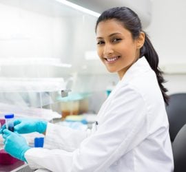 RS6420_sy_scientist_holding_conical_tube_sh_211212433_clean_scr